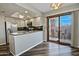 Kitchen with white cabinets, stainless steel appliances and a sliding door to the outdoor patio at 17289 E Kirk Ln, Fountain Hills, AZ 85268