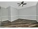 Spacious room with dark wood flooring, crown molding, natural light and neutral walls at 17289 E Kirk Ln, Fountain Hills, AZ 85268