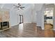 Living area with brick fireplace, vaulted ceilings, sliding glass doors and view into updated kitchen at 17289 E Kirk Ln, Fountain Hills, AZ 85268