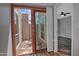 Patio access from inside featuring desert landscaping with a large Saguaro cactus at 17289 E Kirk Ln, Fountain Hills, AZ 85268
