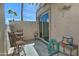 Private patio with neutral stucco walls, an outdoor dining set, and a sliding glass door at 17289 E Kirk Ln, Fountain Hills, AZ 85268
