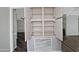 A set of open shelves with white trim and modern hardware, offering ample storage space and a clean aesthetic at 17289 E Kirk Ln, Fountain Hills, AZ 85268