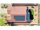 A bird's eye view showcases the home's tile roof, solar panels, covered patio, and backyard landscaping at 17514 W Desert Sage Dr, Goodyear, AZ 85338