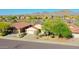 A high angle view showcases a desert home with mountain views at 17514 W Desert Sage Dr, Goodyear, AZ 85338