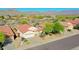 An elevated view of desert homes is set against a mountain backdrop at 17514 W Desert Sage Dr, Goodyear, AZ 85338