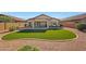 Spacious backyard with an outdoor kitchen, covered patio and low-maintenance artificial turf at 17514 W Desert Sage Dr, Goodyear, AZ 85338