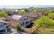 Beautiful backyard features a covered patio, artificial turf, desert landscaping, and partial pool with mountain views at 17514 W Desert Sage Dr, Goodyear, AZ 85338