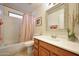 Cozy bathroom featuring a vanity, toilet, framed mirror, and shower with tub at 17514 W Desert Sage Dr, Goodyear, AZ 85338
