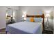 This bedroom features wood-look floors and a window with sunlight at 17514 W Desert Sage Dr, Goodyear, AZ 85338