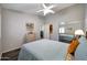 This bedroom features wood-look floors and a mirrored closet at 17514 W Desert Sage Dr, Goodyear, AZ 85338