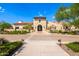 Elegant clubhouse exterior with stone accents, manicured landscaping, and a welcoming entrance at 17514 W Desert Sage Dr, Goodyear, AZ 85338