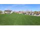 Expansive green community lawn with covered seating areas and well-maintained landscaping at 17514 W Desert Sage Dr, Goodyear, AZ 85338