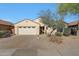 Single Gathering home showcasing desert landscaping, driveway, and a two-car garage at 17514 W Desert Sage Dr, Goodyear, AZ 85338