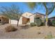 Charming single-Gathering home with desert landscaping, a two-car garage, and a welcoming entrance at 17514 W Desert Sage Dr, Goodyear, AZ 85338