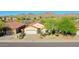 A charming single-Gathering home with a two-car garage, desert landscaping, and a mountain backdrop at 17514 W Desert Sage Dr, Goodyear, AZ 85338