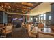 Upscale game room with pool table, TVs, comfortable seating, and elegant lighting at 17514 W Desert Sage Dr, Goodyear, AZ 85338