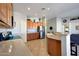 This spacious kitchen features stainless steel appliances and a breakfast bar area at 17514 W Desert Sage Dr, Goodyear, AZ 85338