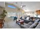 Bright and spacious living room with vaulted ceilings, comfortable seating, and natural light at 17514 W Desert Sage Dr, Goodyear, AZ 85338