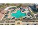 Aerial view of a large community pool surrounded by lounge chairs and umbrellas at 17514 W Desert Sage Dr, Goodyear, AZ 85338