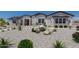 Stunning single-story home featuring low-maintenance desert landscaping, rocks, and cacti at 1845 N 103Rd St, Mesa, AZ 85207