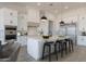 Beautiful kitchen with a large island, modern lighting, and sleek, stainless steel appliances at 1845 N 103Rd St, Mesa, AZ 85207