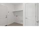 Clean, functional laundry room with tile flooring and modern hookups at 20332 W Sells Dr, Buckeye, AZ 85396