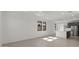 Airy living area showcasing modern recessed lighting and bright windows allowing natural sunlight to illuminate the open space at 20332 W Sells Dr, Buckeye, AZ 85396