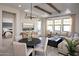 Bright living room featuring coffered ceilings, wood beams, large windows, and comfortable seating arrangements at 20332 W Sells Dr, Buckeye, AZ 85396