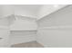 Walk-in closet with built-in shelving for ample storage at 20332 W Sells Dr, Buckeye, AZ 85396