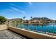 Balcony view of lake, palm trees, blue sky, and mountains in the background at 20713 N 56Th Ave, Glendale, AZ 85308