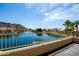 Balcony view of lake, palm trees, boats, blue sky, and mountains in the background at 20713 N 56Th Ave, Glendale, AZ 85308