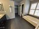 Bathroom featuring bathtub, vanity with double sinks, and walk-in closet at 20713 N 56Th Ave, Glendale, AZ 85308
