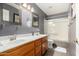 Bathroom features a double vanity and tub-shower combination with modern fixtures at 20713 N 56Th Ave, Glendale, AZ 85308