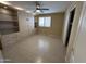 Bedroom with built-in shelving, closet, window with shutters, and ceiling fan at 20713 N 56Th Ave, Glendale, AZ 85308