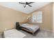 A well-lit bedroom with a ceiling fan, offering a comfortable living space at 20713 N 56Th Ave, Glendale, AZ 85308