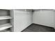 A walk-in closet with modern tile flooring and shelving creates organized storage at 20713 N 56Th Ave, Glendale, AZ 85308