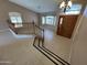 Grand entryway boasts wood staircase, tiled floor and lots of natural light at 20713 N 56Th Ave, Glendale, AZ 85308