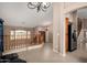 Open concept living space with views of entryway, stairs, and kitchen at 20713 N 56Th Ave, Glendale, AZ 85308