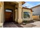 Charming stucco home featuring a tile roof, brick-lined walkway, and beautiful landscaping at 20713 N 56Th Ave, Glendale, AZ 85308