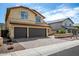 Charming two-story home with a tile roof, arched windows, and a well-manicured front yard at 20713 N 56Th Ave, Glendale, AZ 85308