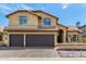 Charming two-story home with a tile roof, arched windows, and a well-manicured front yard at 20713 N 56Th Ave, Glendale, AZ 85308