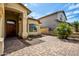 Beautiful front entrance with a brick paved driveway, mature landscaping and covered entry at 20713 N 56Th Ave, Glendale, AZ 85308