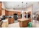 Bright kitchen with stainless appliances, granite counters, kitchen island, and plenty of cabinet space at 20713 N 56Th Ave, Glendale, AZ 85308
