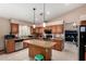 Well-appointed kitchen with granite counters, stainless steel appliances, and a functional center island at 20713 N 56Th Ave, Glendale, AZ 85308