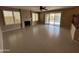 Living room features a fireplace, sliding glass doors to patio, and tile flooring at 20713 N 56Th Ave, Glendale, AZ 85308