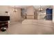 Open concept living area with staircase and railing, offering ample space and natural light at 20713 N 56Th Ave, Glendale, AZ 85308