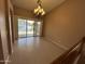 Bright living room with beautiful chandelier and sliding glass doors to the patio at 20713 N 56Th Ave, Glendale, AZ 85308