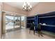 Bright living room with sliding glass doors leading to a patio and lake views at 20713 N 56Th Ave, Glendale, AZ 85308