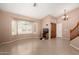 Inviting living room with tile floors, a bay window with shutters, and neutral paint at 20713 N 56Th Ave, Glendale, AZ 85308