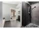 Modern primary bathroom with a tiled walk-in shower, a door to the bedroom, and a granite vanity at 20713 N 56Th Ave, Glendale, AZ 85308